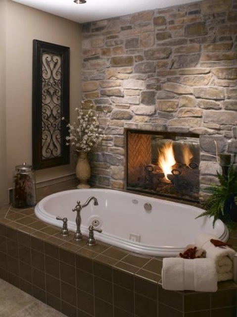 a natural stone wall is a cool idea to accent the bathing space, it brings a natural feel