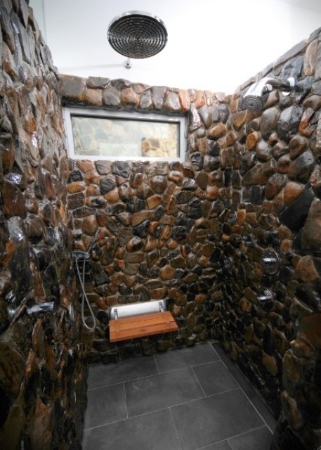 a gorgeous shower space all clad with natural stone will make you feel as if you are having a shower somewhere outdoors