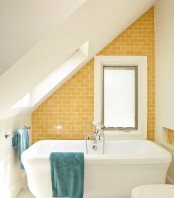a small yellow attic bathroom design